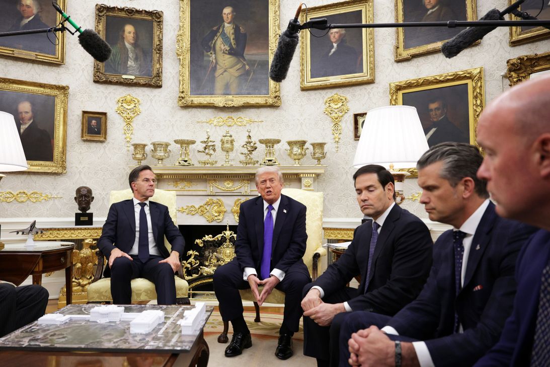 US President Donald Trump speaks to reporters during a meeting with NATO Secretary General Mark Rutte as Secretary of State Marco Rubio and Secretary of War Pete Hegseth (R) look on in the Oval Office of the White House on October 22, 2025 in Washington, DC.