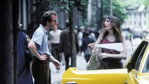 Silver Screen Collection / Contributor Actor, writer and director Woody Allen as Alvy Singer and actress Diane Keaton as Annie Hall in the film of the same name in 1977.