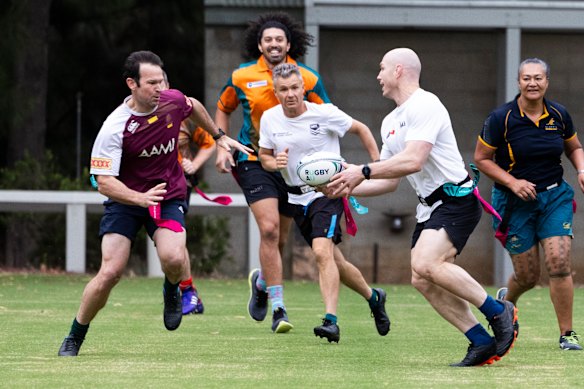 Pocock and fellow senator Matt Canavan (left) during a touch rugby match hosted by the Australian Parliament Sports Club last year.