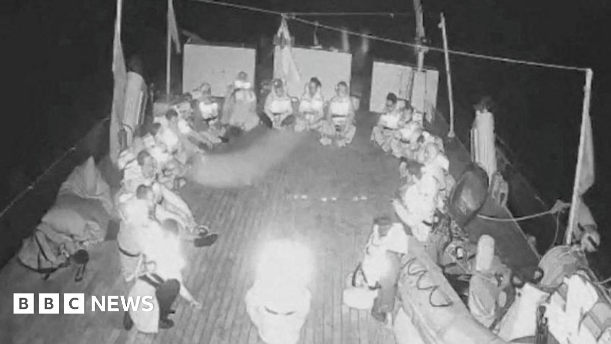 A screengrab from a live video footage shows crew members sitting in a circle aboard the Gaza-bound Alma vessel, part of the Global Sumud Flotilla