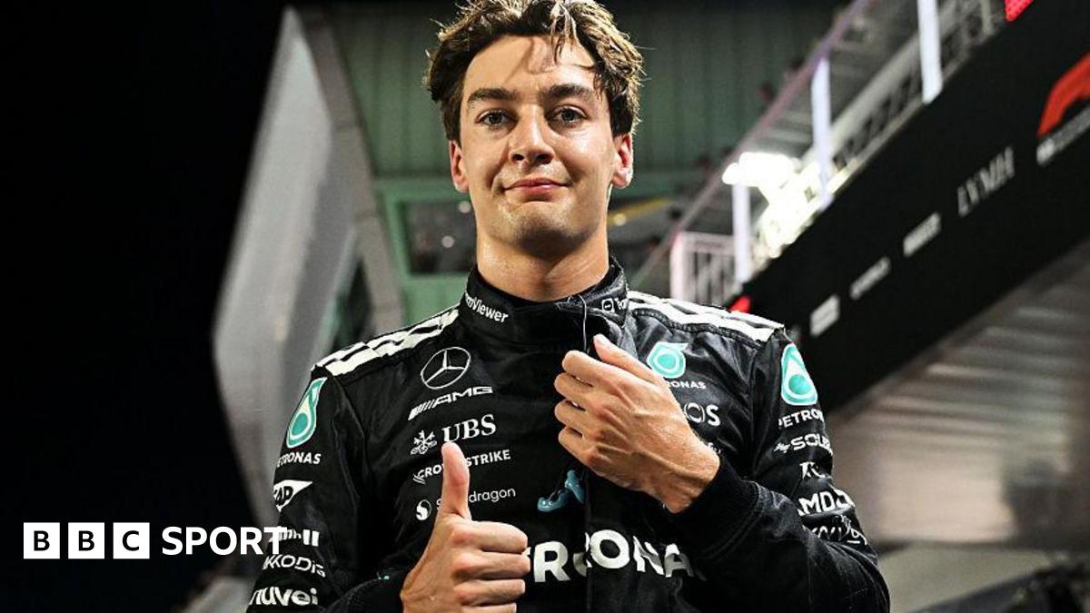 Mercedes' George Russell gives the thumbs-up signal after taking pole position for the Singapore Grand Prix