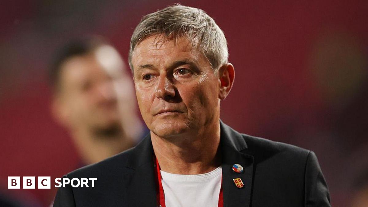 Harry Kane claps while playing for England