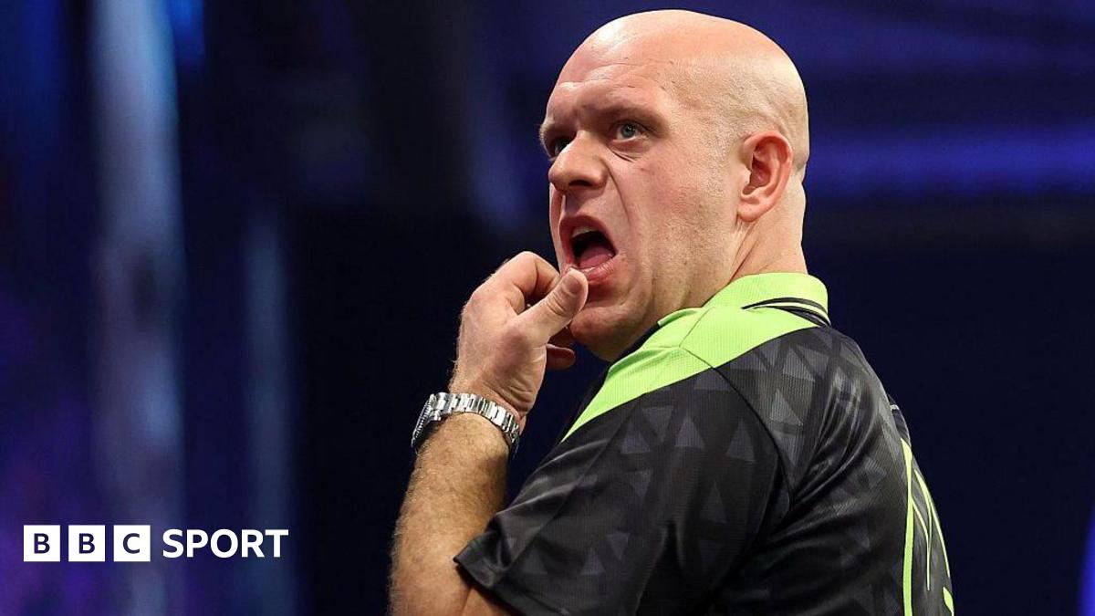 Michael van Gerwen in green and black darts outfit