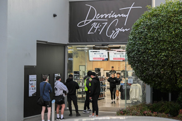 People line up outside the 24/7 gym in Oakleigh East, in August 2024. Security was hired to manage patron limits.