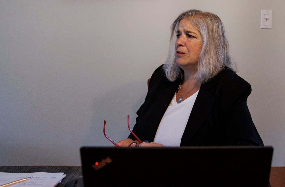 Lawyer Elaine Page, who specializes in landlord-tenant disputes, is pictured at her home office, in Toronto, on July 15, 2024.