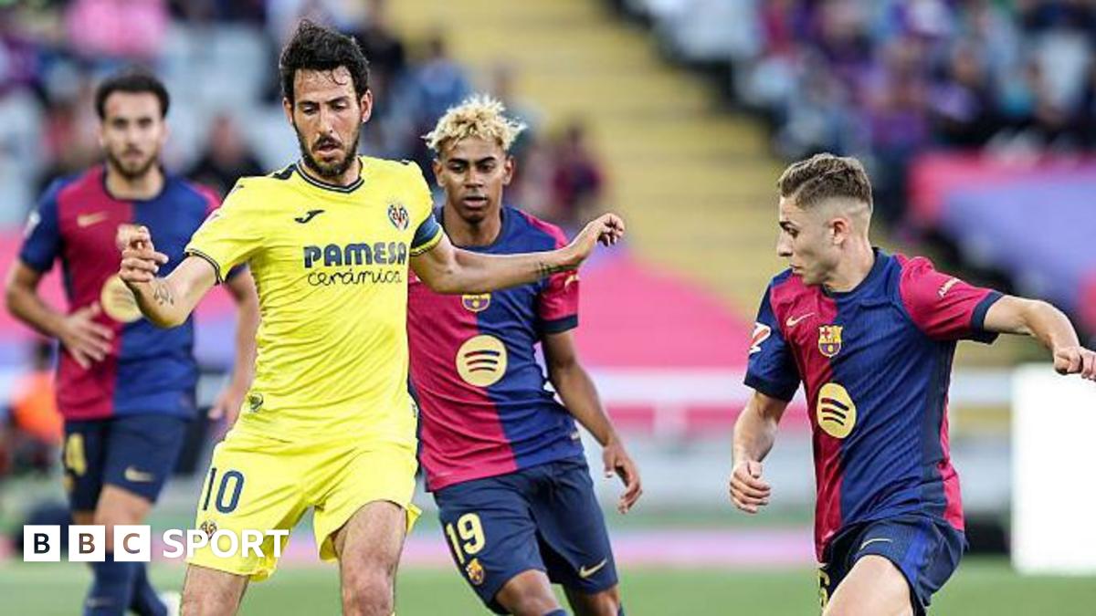 Villarreal's Dani Parejo with the ball under pressure from Barcelona's Fermin Lopez and Lamine Yamal.