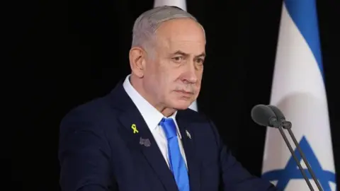 EPA Benjamin Netanyahu standing behind a podium 