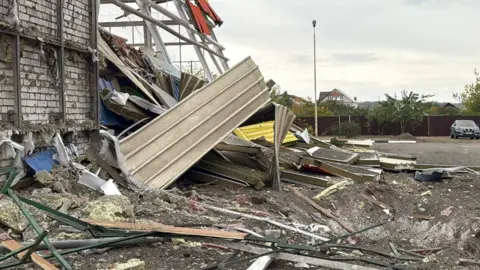Vyacheslav Gladkov A crater next to a sports complex building destroyed by what local authorities called a recent Ukrainian missile attack in the course of Russia-Ukraine conflict, in the settlement of Maslova Pristan in the Belgorod Region, Russia October 8, 2025