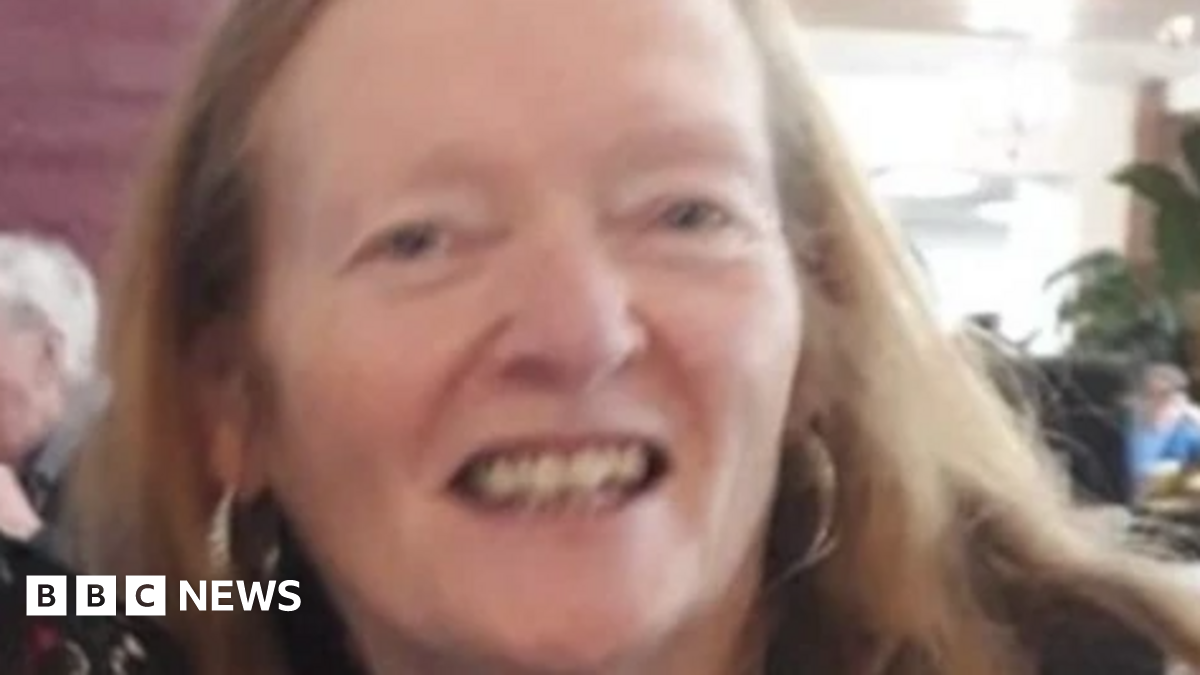 Rose Johnston, smiling with light red hair