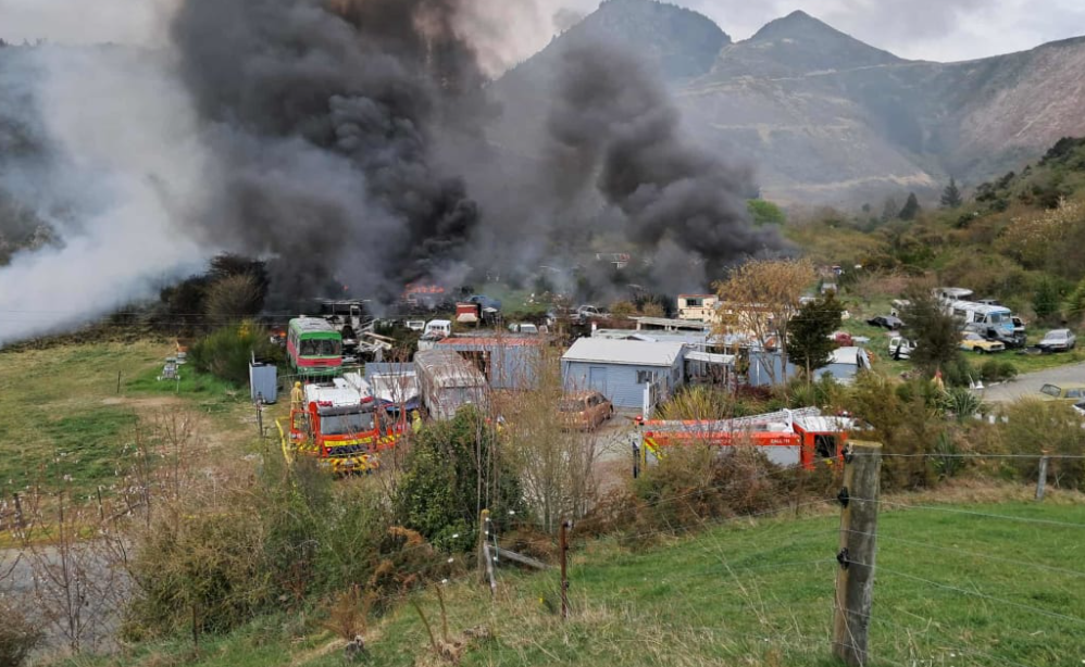 Vehicles damaged in fire at property linked to cold case