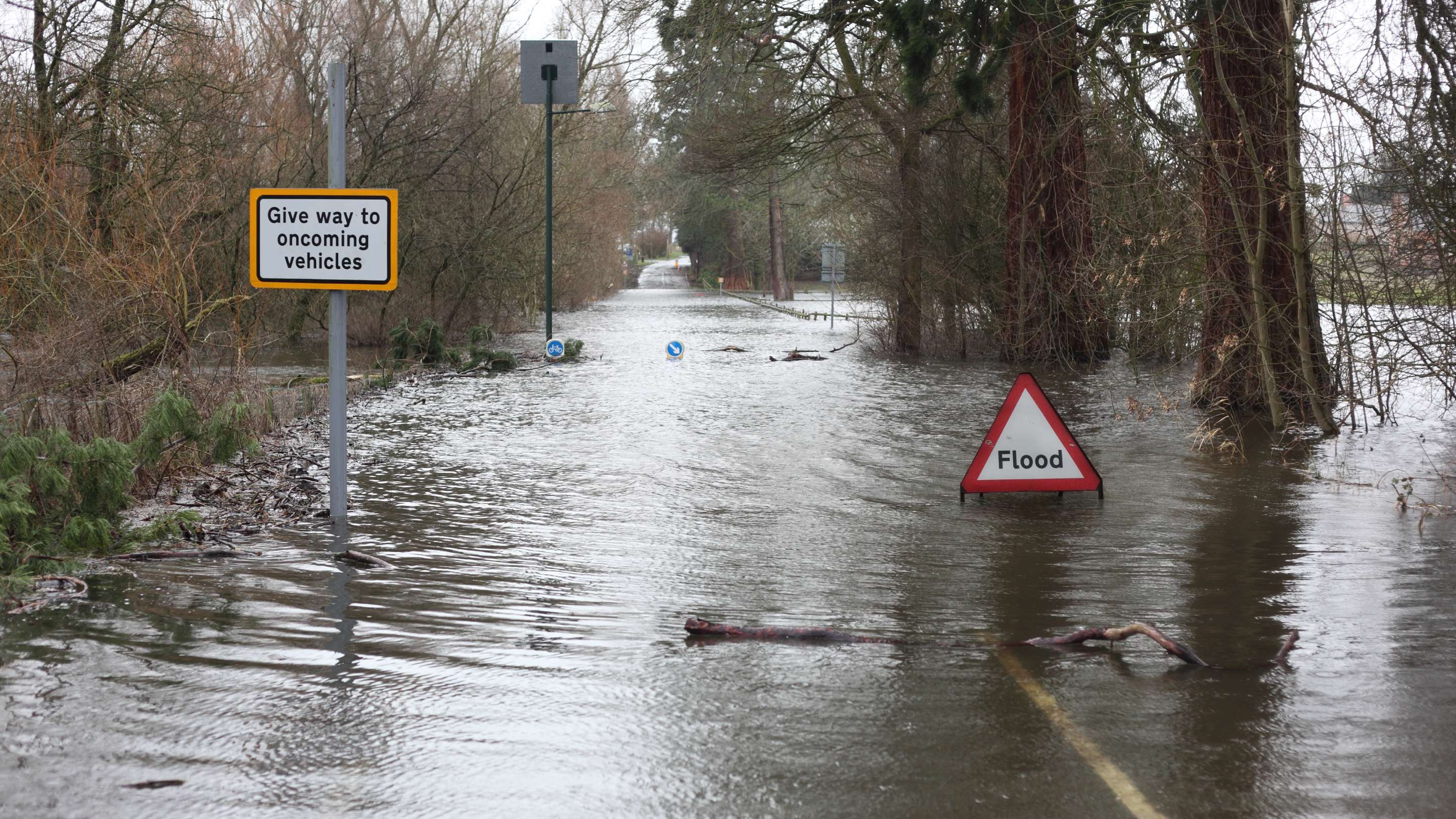 Flood sign in flooded street