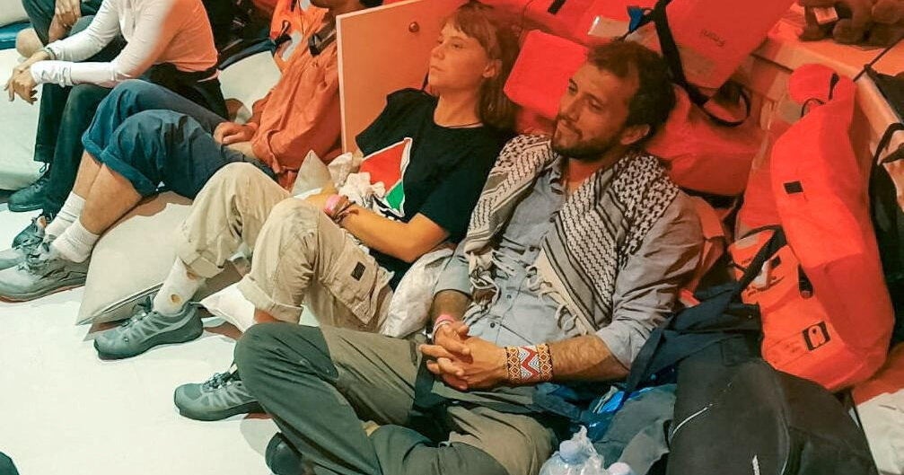Swedish activist Greta Thunberg and Brazilian activist Thiago Avila sit in a vessel with members of the Global Sumud Flotilla, making their way to Israel
