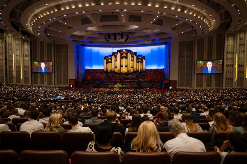 Audience members listen during the Sunday afternoon session of the 194th Semiannual General Confere...