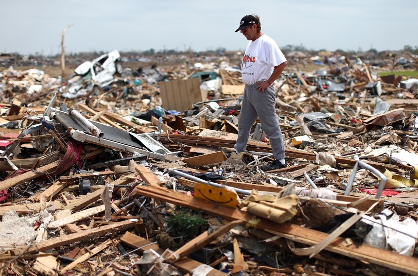 Homeowner Russell Shearer looks over the rubble of his destroyed home on May 24, 2013 in Moore, Oklahoma.