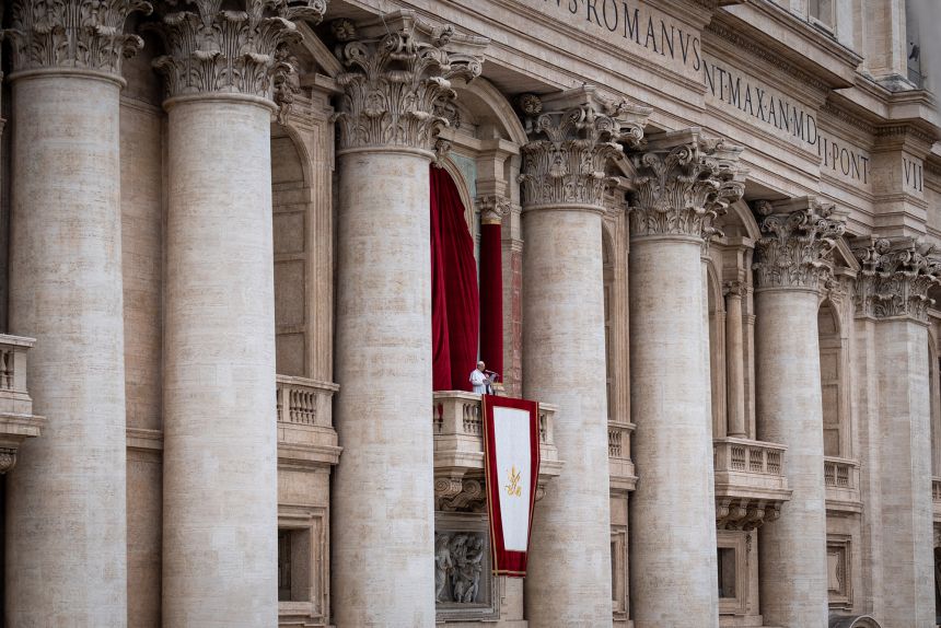 Pope Leo XIV greets the faithful from the Central Loggia of St. Peter's Basilica in Vatican City on May 11.