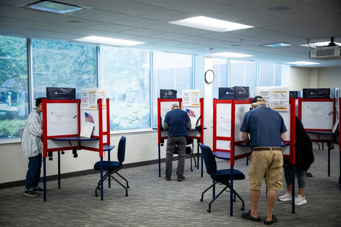 Voters cast ballots at a polling location on the first day of early voting in Leesburg, Virginia, on Friday.