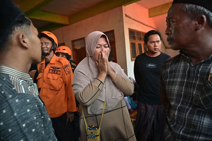 Relatives of missing students gather as search and rescue operations continue at Al Khoziny Islamic boarding school in Sidoarjo on Wednesday.