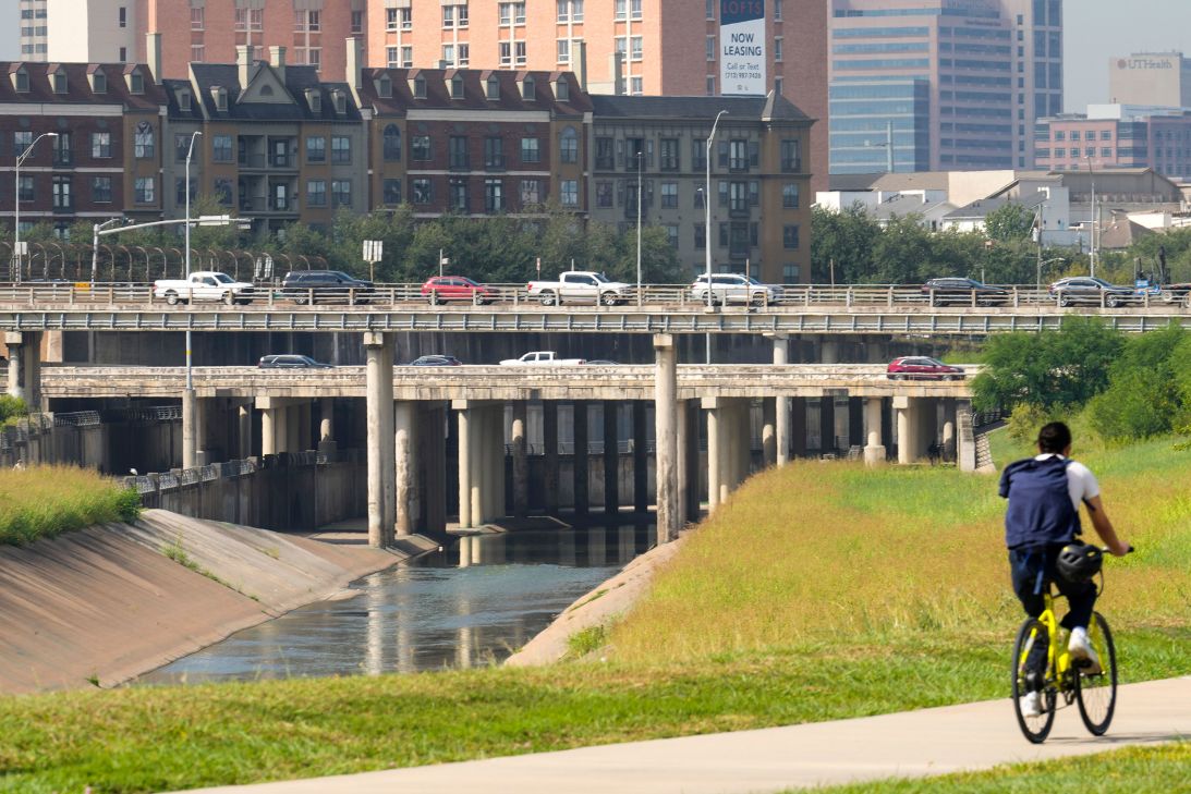 A cyclist rides alongside Brays Bayou near the Texas Medical Center in Houston on September 30.