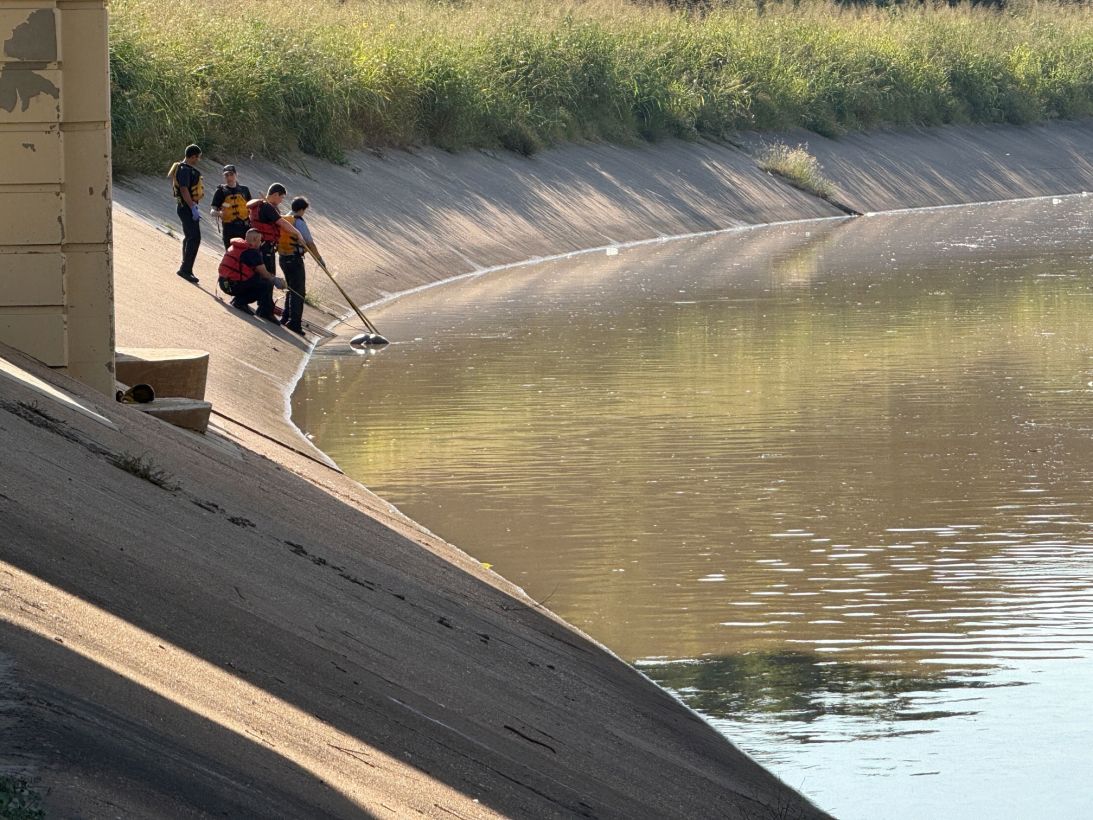 First responders search in the water at White Oak Bayou in Houston on October 8