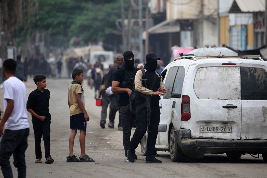 Members of the internal security forces man a checkpoint in the Nuseirat refugee camp.