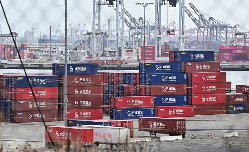 Shipping containers from Hede Shipping, from the Chinese state-owned Hebei Port Group, are seen stacked at the Port of Los Angeles in Los Angeles on October 13, 2025.