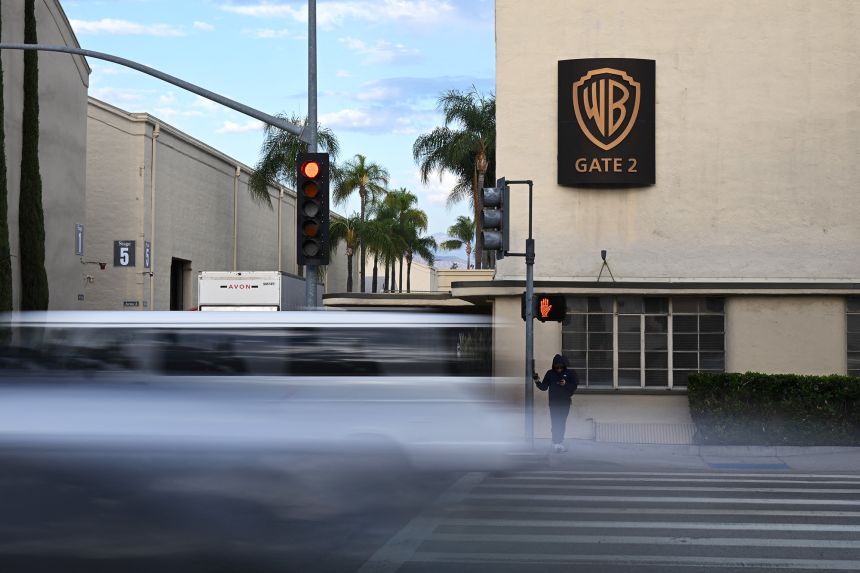 A car drives past the Burbank, California, studios owned by Warner Bros. Discovery, which has put itself up for sale amid interest from “multiple parties.”
