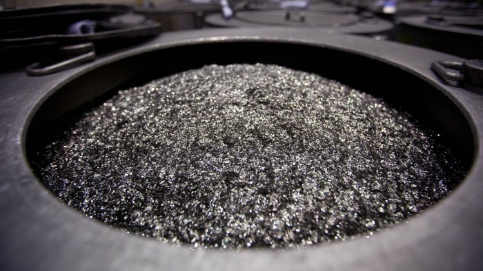 Annealed neodymium iron boron magnets piled in a barrel before being crushed into powder at a factory.