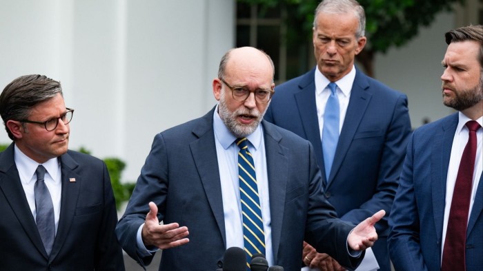 Mike Johnson, Russell Vought, John Thune, and JD Vance speak to the media outside, all wearing suits and appearing serious.