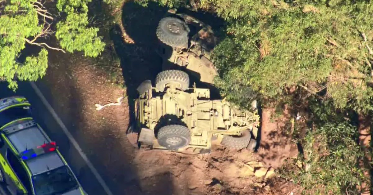 Woman hospitalised after car collides with army truck near Brisbane