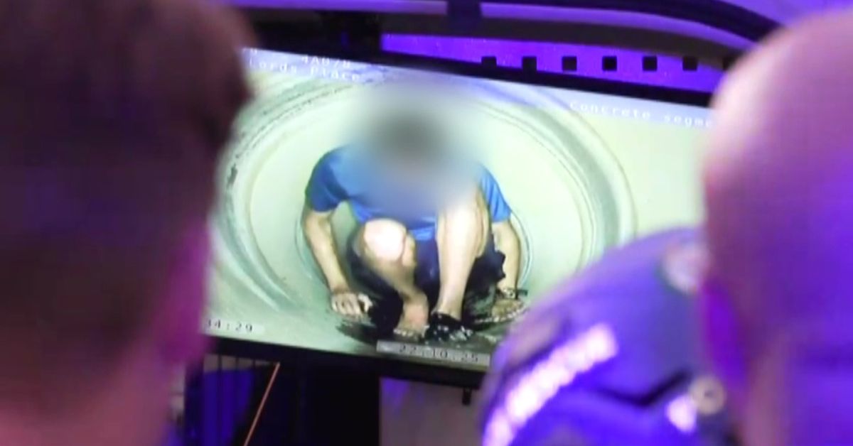 Man wanted on domestic violence charges allegedly found hiding in a drain