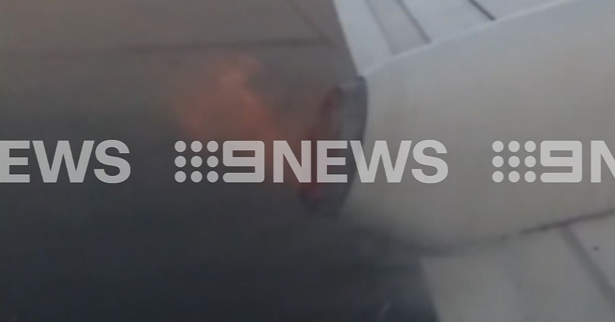 Rex Airlines Passengers look out the window to see plane wing on fire