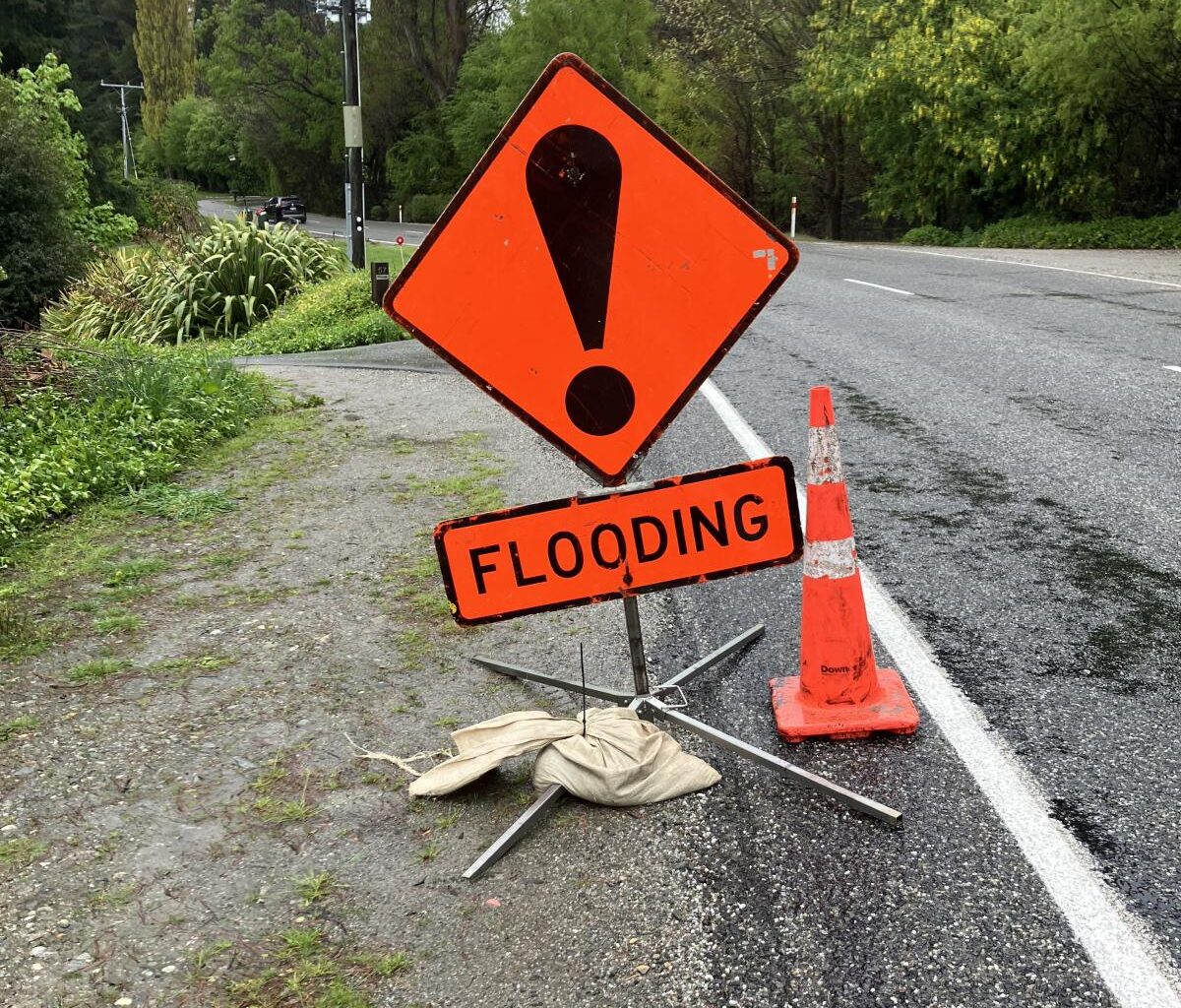 Roads closing, southern lakes at flood warning levels