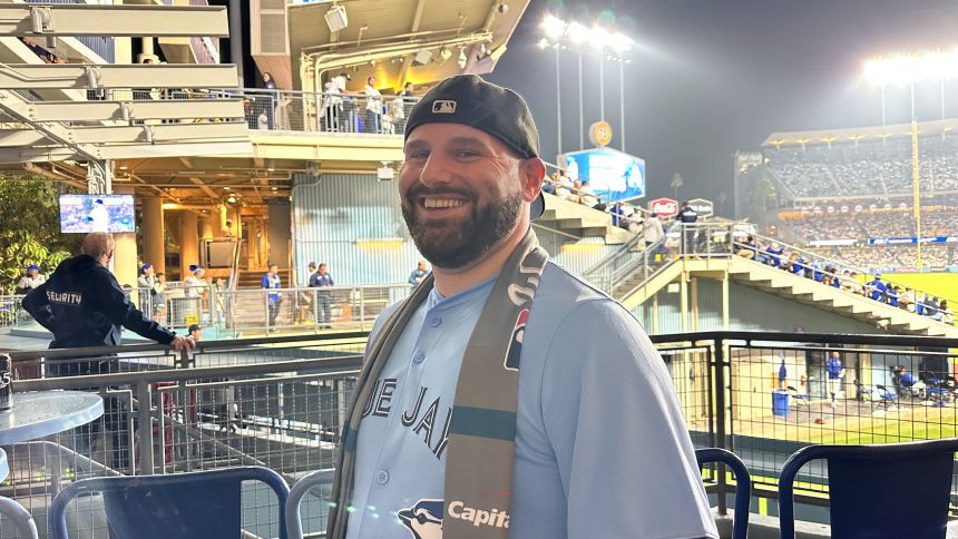 Jat Yassine at the Blue Jays game against the Dodgers in Los Angeles on Monday. The Toronto native found it cheaper to get tickets to see the Jays in the World Series in Los Angeles than in Toronto.