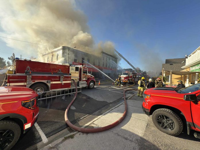 Smoke billows out of the historic building housing Kawartha Home Hardware at 24 Queen Street in downtown Lakefield on October 9, 2025. (Photo: Mike Quigg)