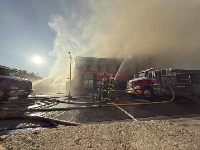 Firefighters battle a blaze at the historic building housing Kawartha Home Hardware at 24 Queen Street in downtown Lakefield on October 9, 2025. (Photo: Mike Quigg)