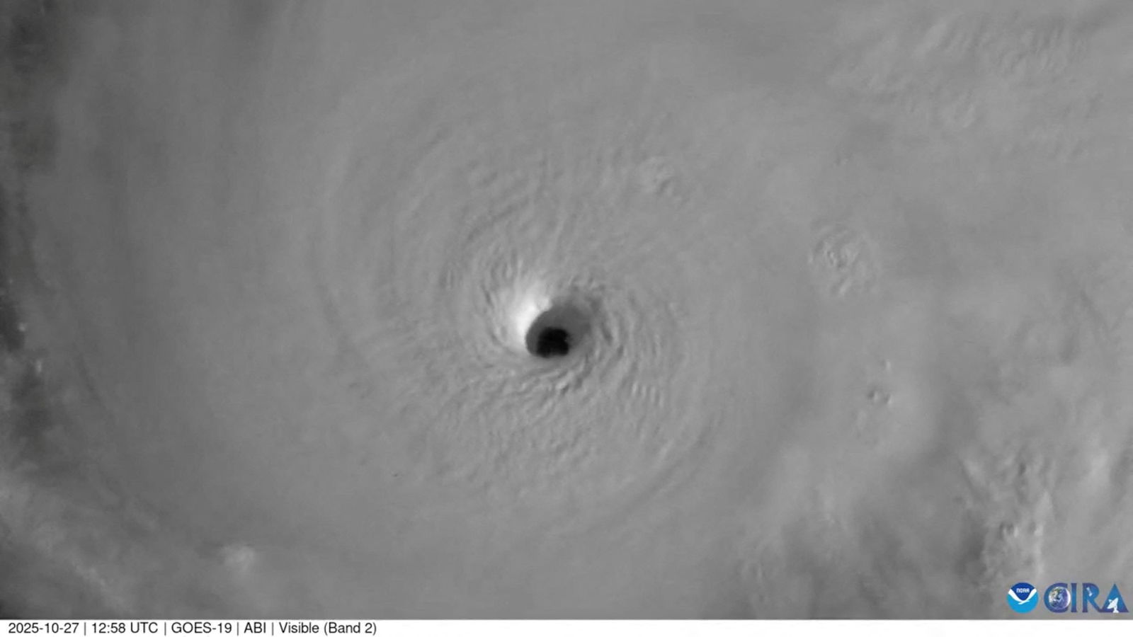 A close up satellite image of a well-defined eye in the middle of a tropical hurricane.