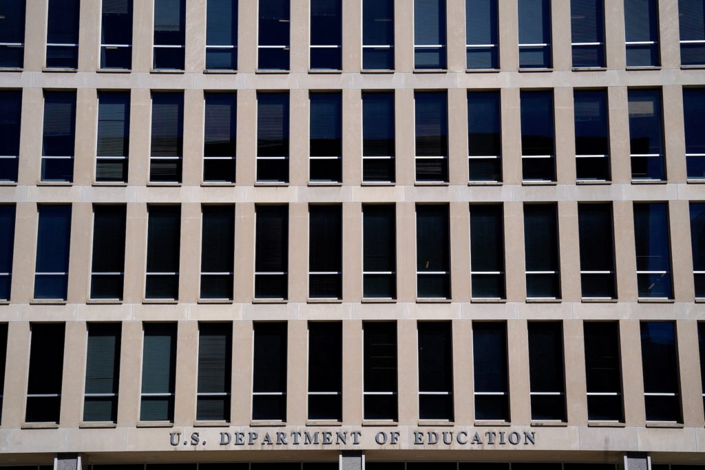 FILE PHOTO: Demonstrators rally in support of U.S.Department of Education outside its building in Washington