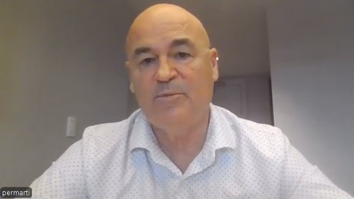 A man speaking to a camera