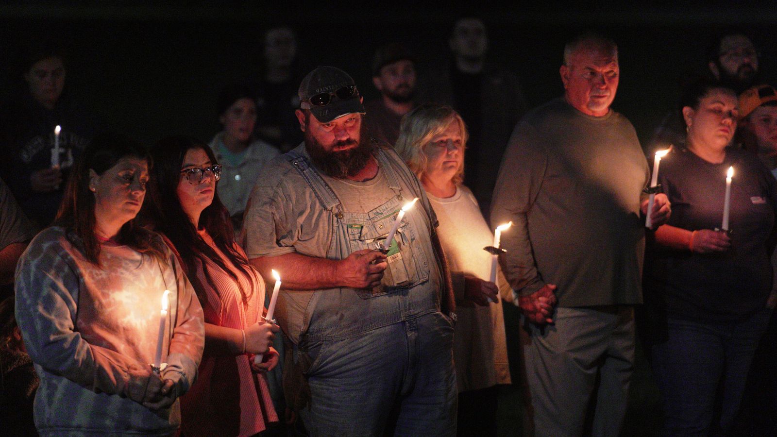Locals held a vigil waiting for news of loved ones. Pic: AP