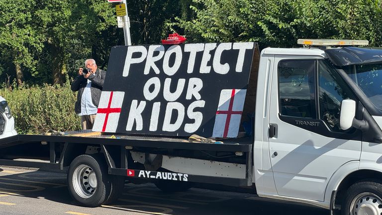 A large "Protect Our Kids" sign was seen on the back of a flatbed van