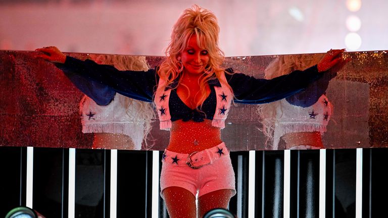 Dolly Parton performs with the Dallas Cowboys cheerleaders in 2023. Pic: Reuters
