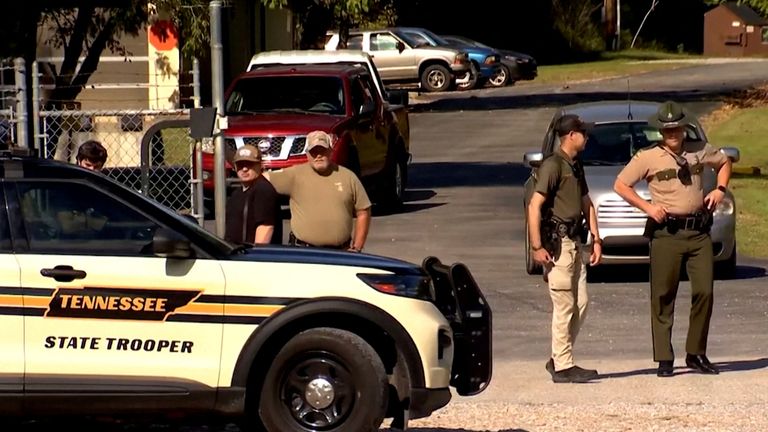 Officers guard the gate at Accurate Energetic Systems military explosives plant. Pic: Reuters