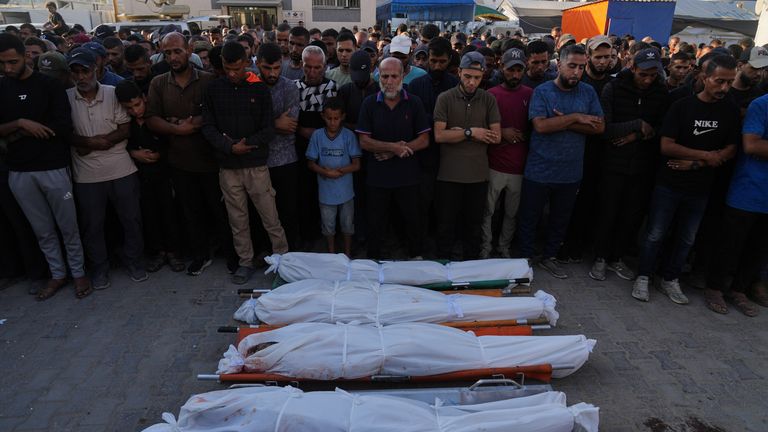 Gazan mourners pray over the bodies of Palestinians killed by Israeli fire. Pic: AP