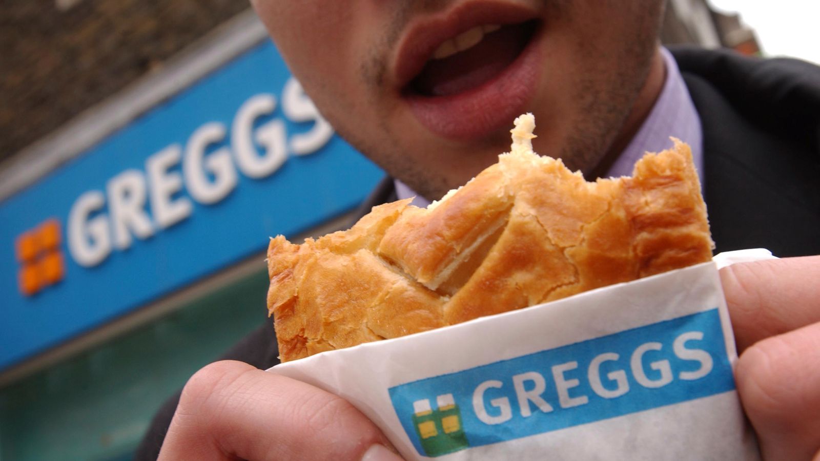 Someone eating a Greggs pasty. Pic: AP