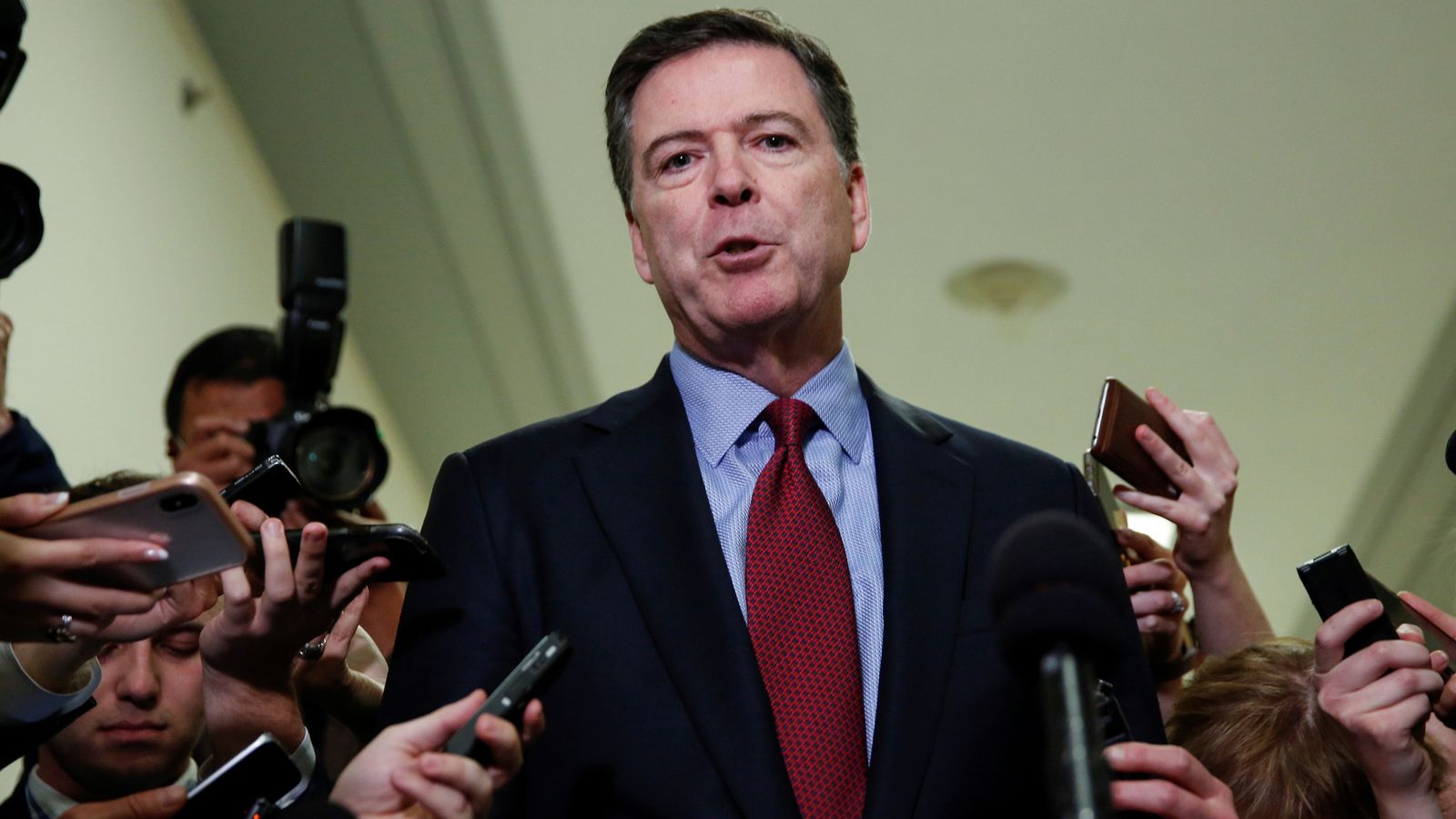 Former FBI director James Comey speaks to the media in 2018. File pic: Reuters