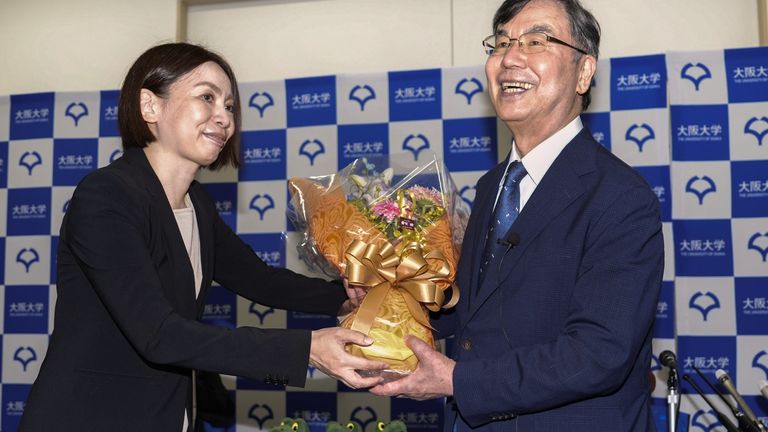 Dr Sakaguchi receiving flowers. Pic: AP
