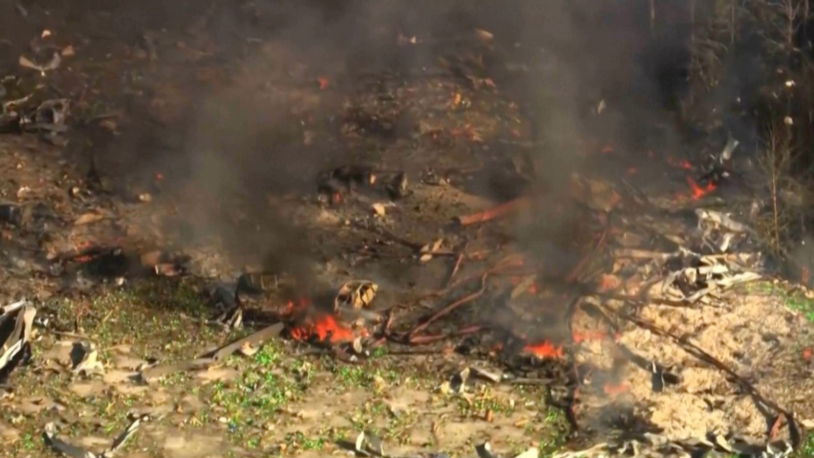 Smoke and debris seen after an explosion at a military explosives manufacturing plant in Tennessee. Pic: WTVF-TV / AP