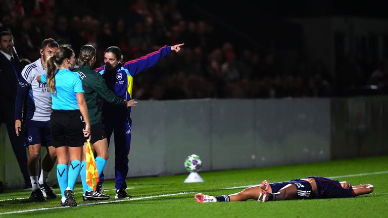 Renee Slegers is conversation with the fourth official at Meadow Park