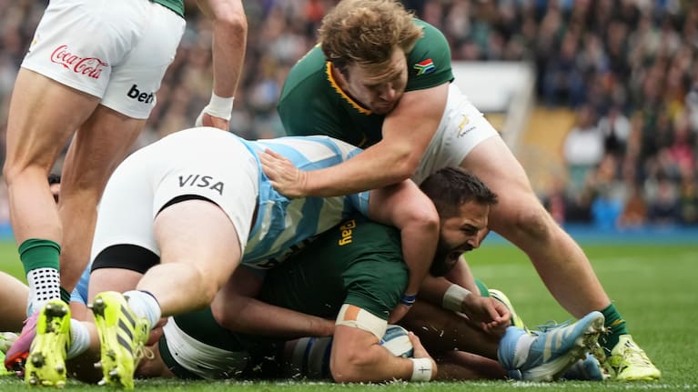 South Africa's Cobus Reinach, bottom right, scores a try during the Rugby Championship match between Argentina and South Africa at Twickenham