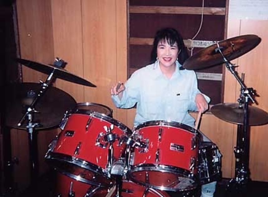 Takaichi is seen playing the drums in an undated photo. She is a fan of heavy metal music.